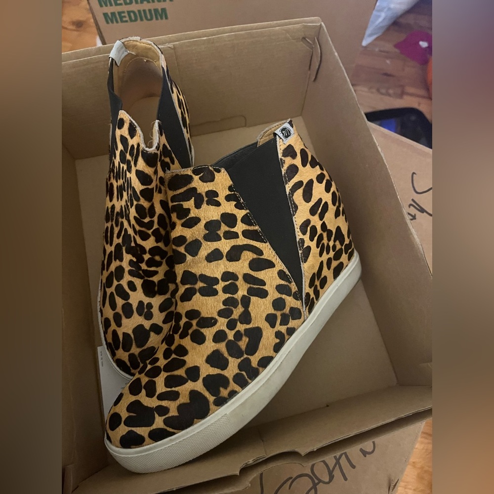 Faux fur leopard wedges. They run a little big, worn twice.